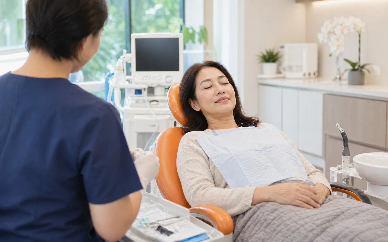Patient relaxing in a dental sedation chair